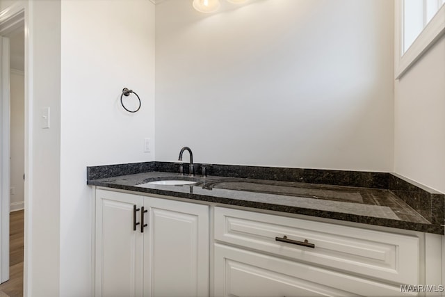 bathroom featuring vanity and wood-type flooring