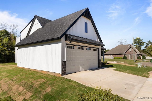 view of side of property featuring a yard and a garage