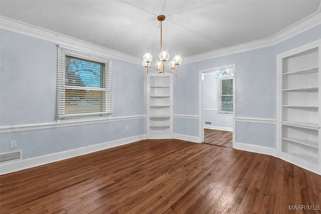 unfurnished dining area with built in features, wood-type flooring, crown molding, and a chandelier