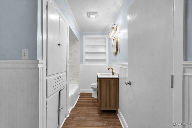 full bathroom featuring ornamental molding, vanity, shower / tub combination, hardwood / wood-style floors, and toilet