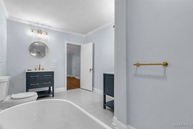 bathroom with tile patterned floors, vanity, toilet, and ornamental molding