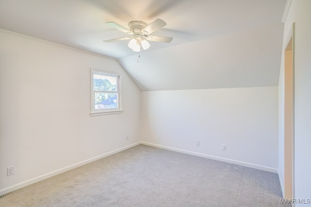 bonus room with light carpet, vaulted ceiling, and ceiling fan