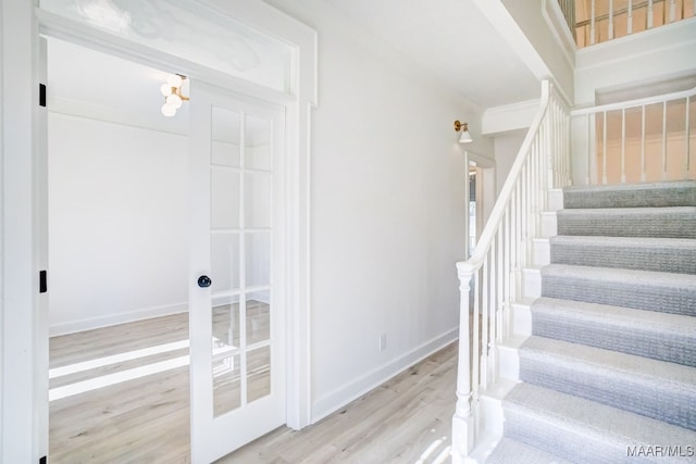 stairs with wood-type flooring