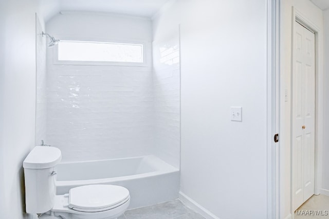 bathroom with  shower combination, tile patterned floors, and toilet