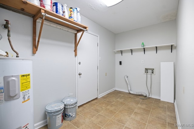 washroom featuring water heater and hookup for a washing machine