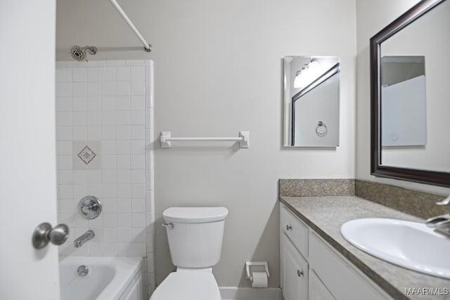 full bathroom featuring toilet, vanity, and tiled shower / bath combo