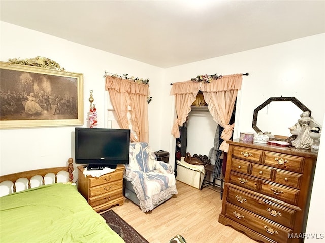 bedroom featuring hardwood / wood-style floors