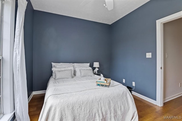 bedroom featuring ceiling fan and hardwood / wood-style flooring