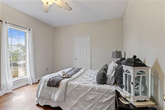 bedroom featuring ceiling fan and hardwood / wood-style floors