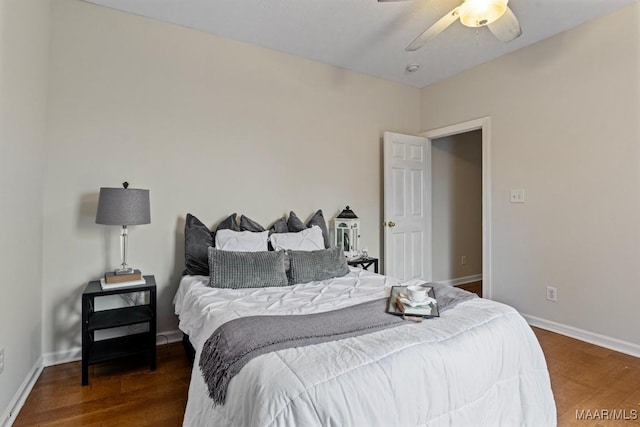 bedroom featuring ceiling fan and dark hardwood / wood-style floors