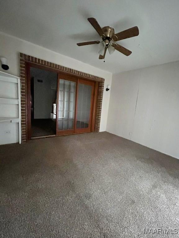 524 Winston Dr Unit 2D, Montgomery, AL 36111 - empty room featuring carpet flooring and ceiling fan