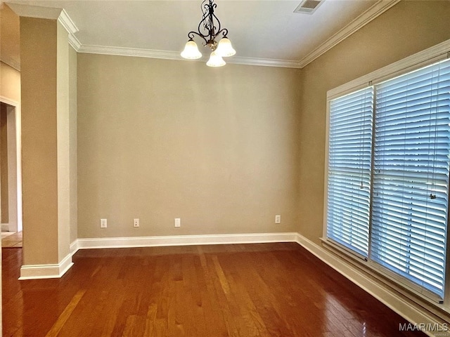 unfurnished room featuring a notable chandelier, dark hardwood / wood-style flooring, and crown molding