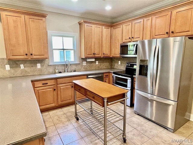 kitchen with sink, stainless steel appliances, backsplash, crown molding, and light tile patterned floors