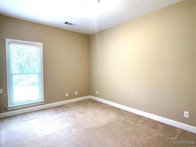 unfurnished room featuring carpet floors