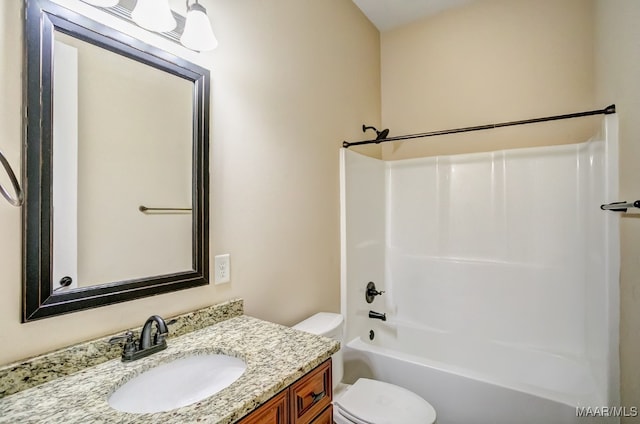 full bathroom featuring shower / washtub combination, vanity, and toilet