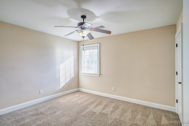 carpeted empty room featuring ceiling fan