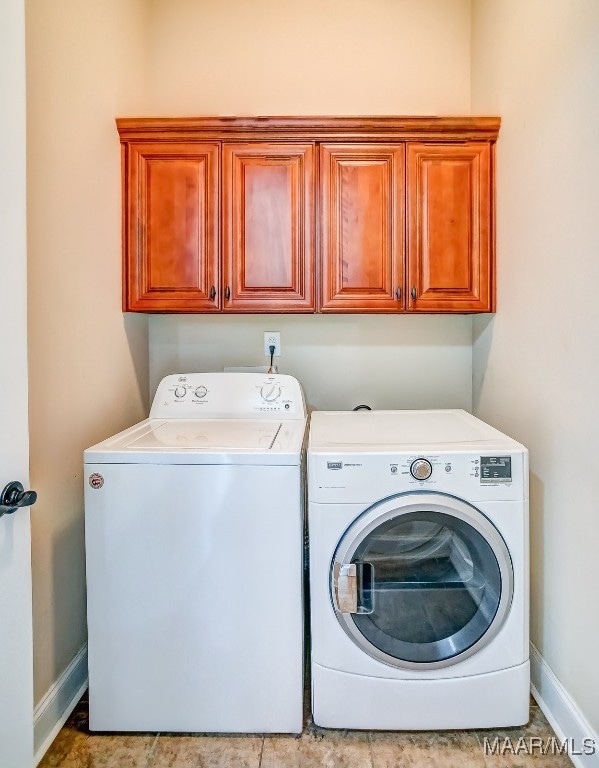 laundry area with cabinets and independent washer and dryer