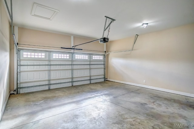 garage featuring a garage door opener