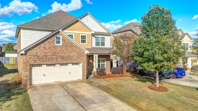 craftsman house with a garage and a front yard