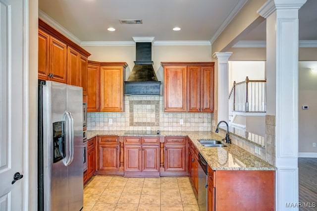 kitchen with sink, custom range hood, stainless steel appliances, and ornate columns