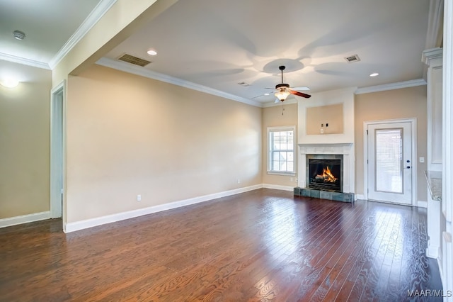 unfurnished living room featuring a fireplace, dark hardwood / wood-style floors, ceiling fan, and ornamental molding