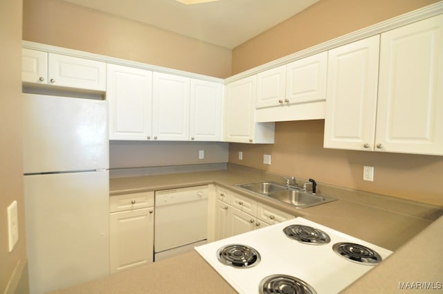 kitchen featuring white cabinets and white appliances