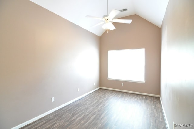 spare room with hardwood / wood-style flooring, ceiling fan, and vaulted ceiling