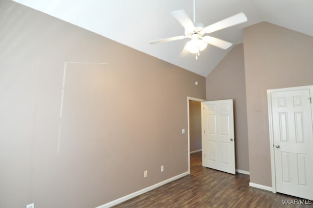 unfurnished bedroom with ceiling fan, dark hardwood / wood-style flooring, and lofted ceiling