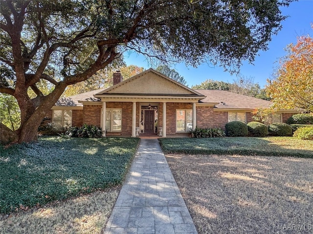 ranch-style house with a front yard