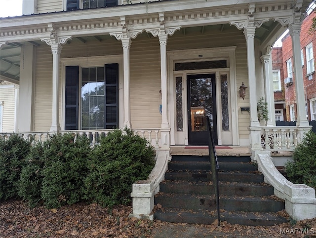 doorway to property with covered porch