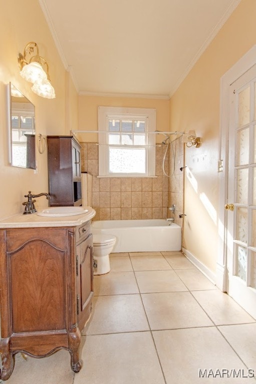 full bathroom featuring tile patterned floors, tiled shower / bath combo, ornamental molding, and vanity