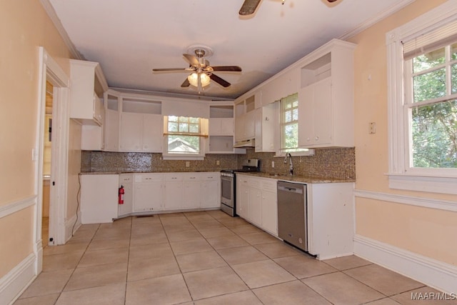 kitchen featuring a wealth of natural light, white cabinetry, and appliances with stainless steel finishes