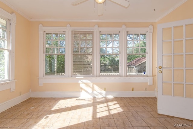 unfurnished sunroom featuring ceiling fan and plenty of natural light