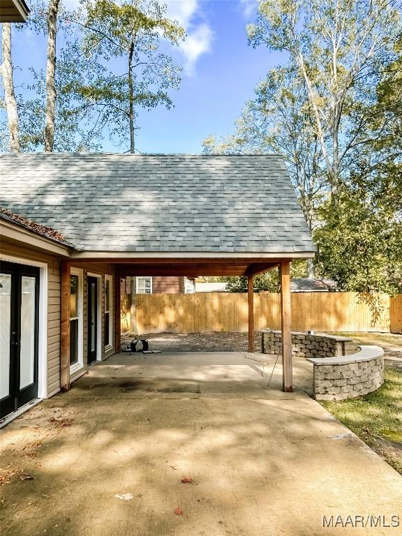 103 Wilkins Rd, Selma, AL 36701 - view of vehicle parking with a fire pit