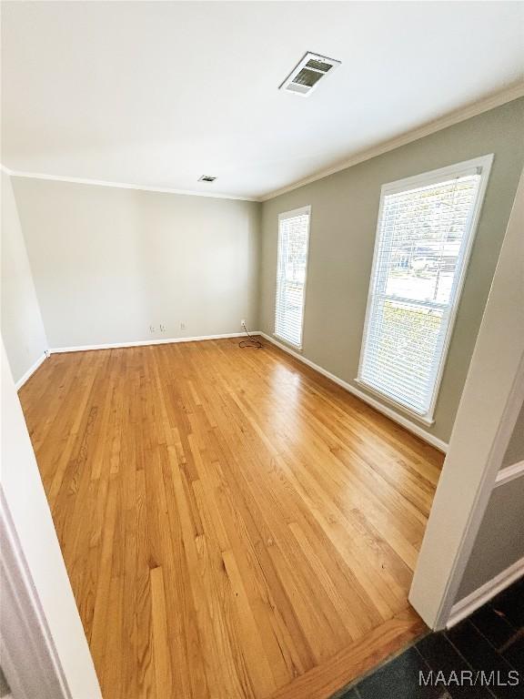 103 Wilkins Rd, Selma, AL 36701 - empty room featuring ornamental molding and wood finished floors