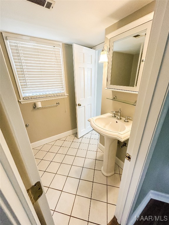 bathroom featuring tile patterned floors and sink