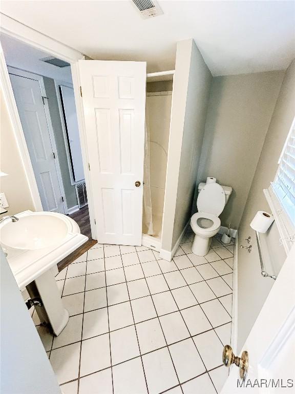 103 Wilkins Rd, Selma, AL 36701 - bathroom with tile patterned flooring and a shower stall