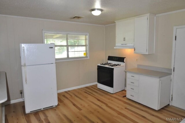 12 Pine St, Montgomery, AL 36110 - kitchen with white appliances, under cabinet range hood, light wood finished floors, ornamental molding, and light countertops