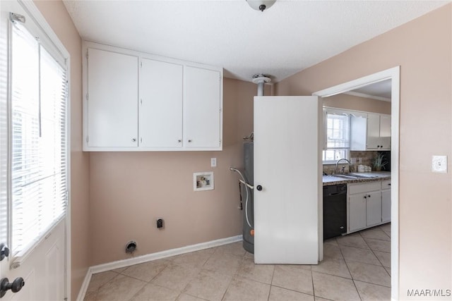 clothes washing area featuring sink, cabinets, electric dryer hookup, hookup for a washing machine, and light tile patterned floors