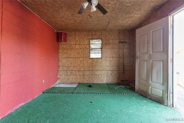 carpeted spare room with ceiling fan