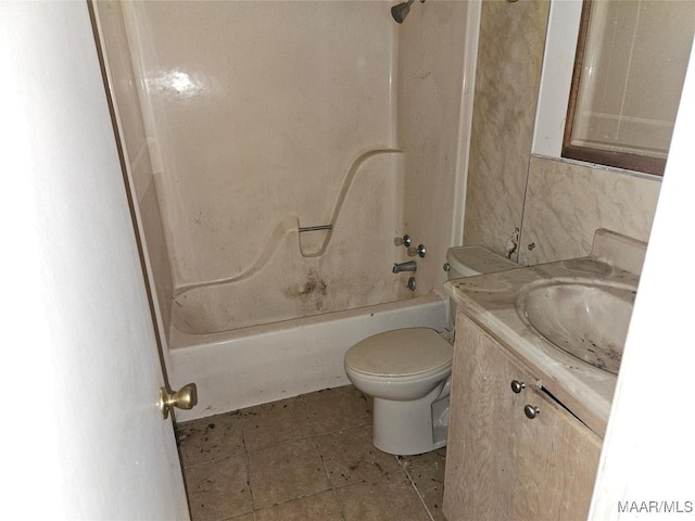 full bathroom featuring toilet, shower / washtub combination, vanity, and tile patterned flooring