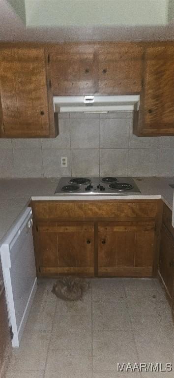 kitchen with tasteful backsplash, white dishwasher, exhaust hood, and stainless steel gas cooktop