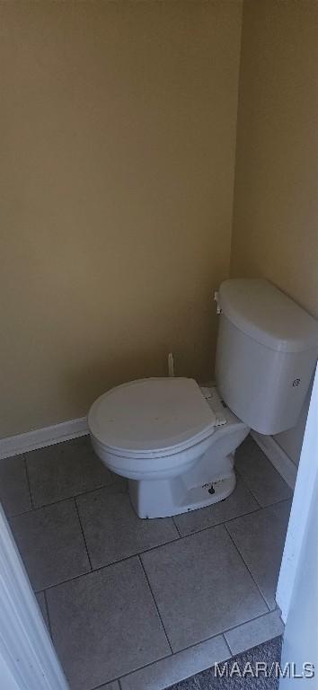 bathroom featuring toilet and tile patterned floors