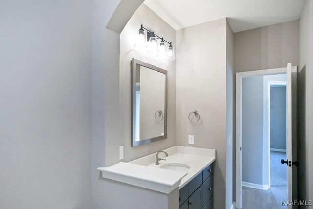 bathroom featuring vanity and baseboards