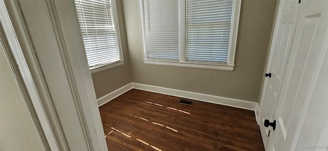 unfurnished bedroom featuring dark hardwood / wood-style floors