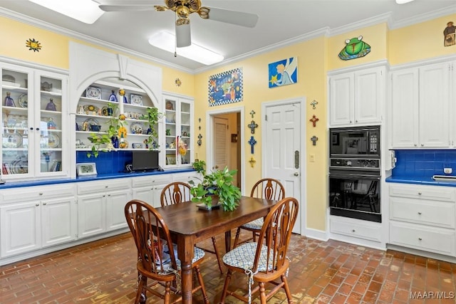 dining space featuring ceiling fan and ornamental molding