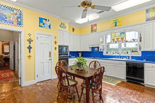 dining space with ceiling fan, ornamental molding, and sink