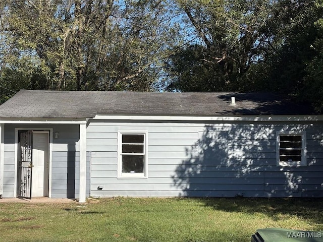 view of property exterior with a yard