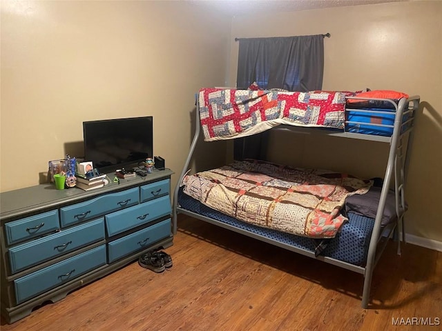 bedroom featuring hardwood / wood-style flooring