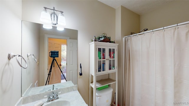 bathroom with vanity and a textured ceiling